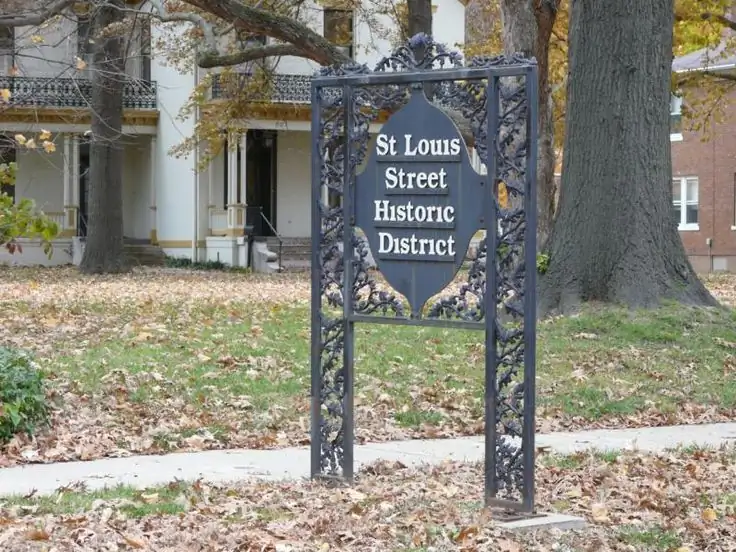 St. Louis Street Historic District sign among mature trees