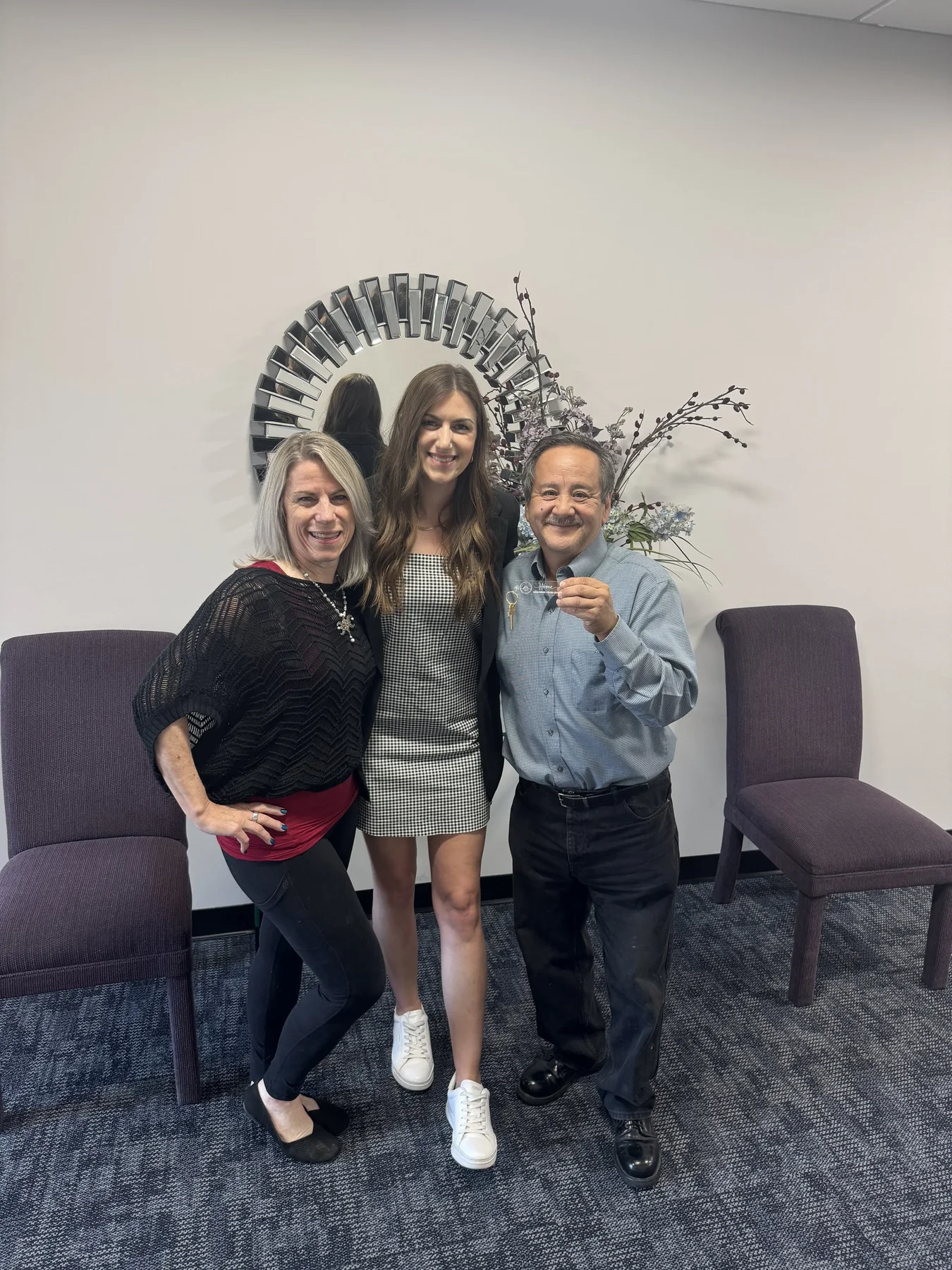 Logan Maggio with clients after a successful Metro East home closing