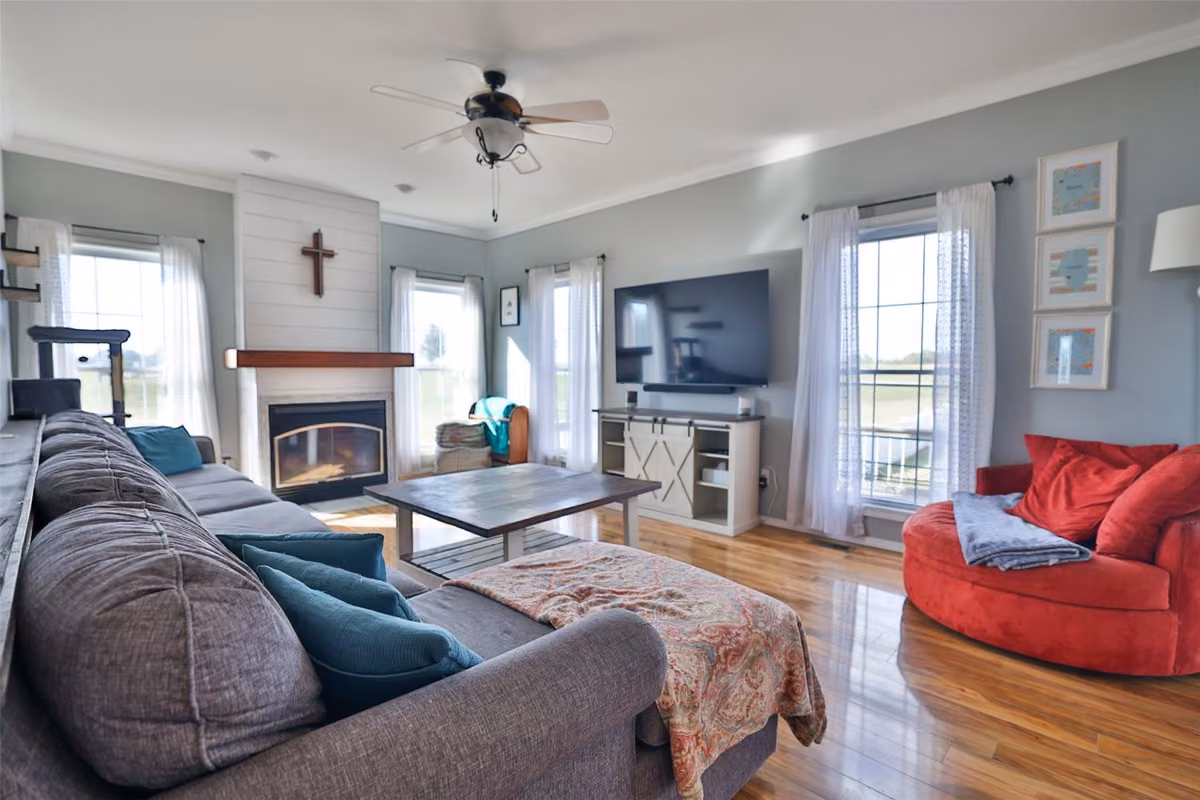 Room with fireplace and built-in shelving at 113 Heritage Trail