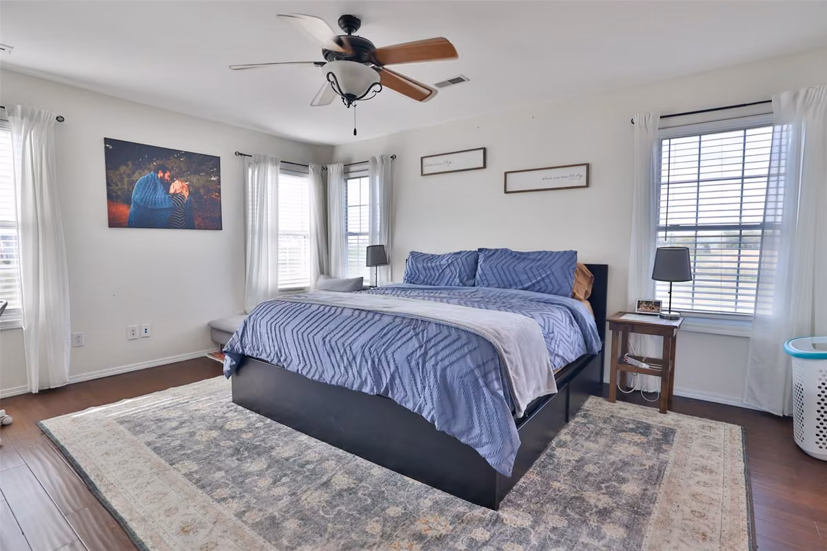 Bedroom with windows on three sides